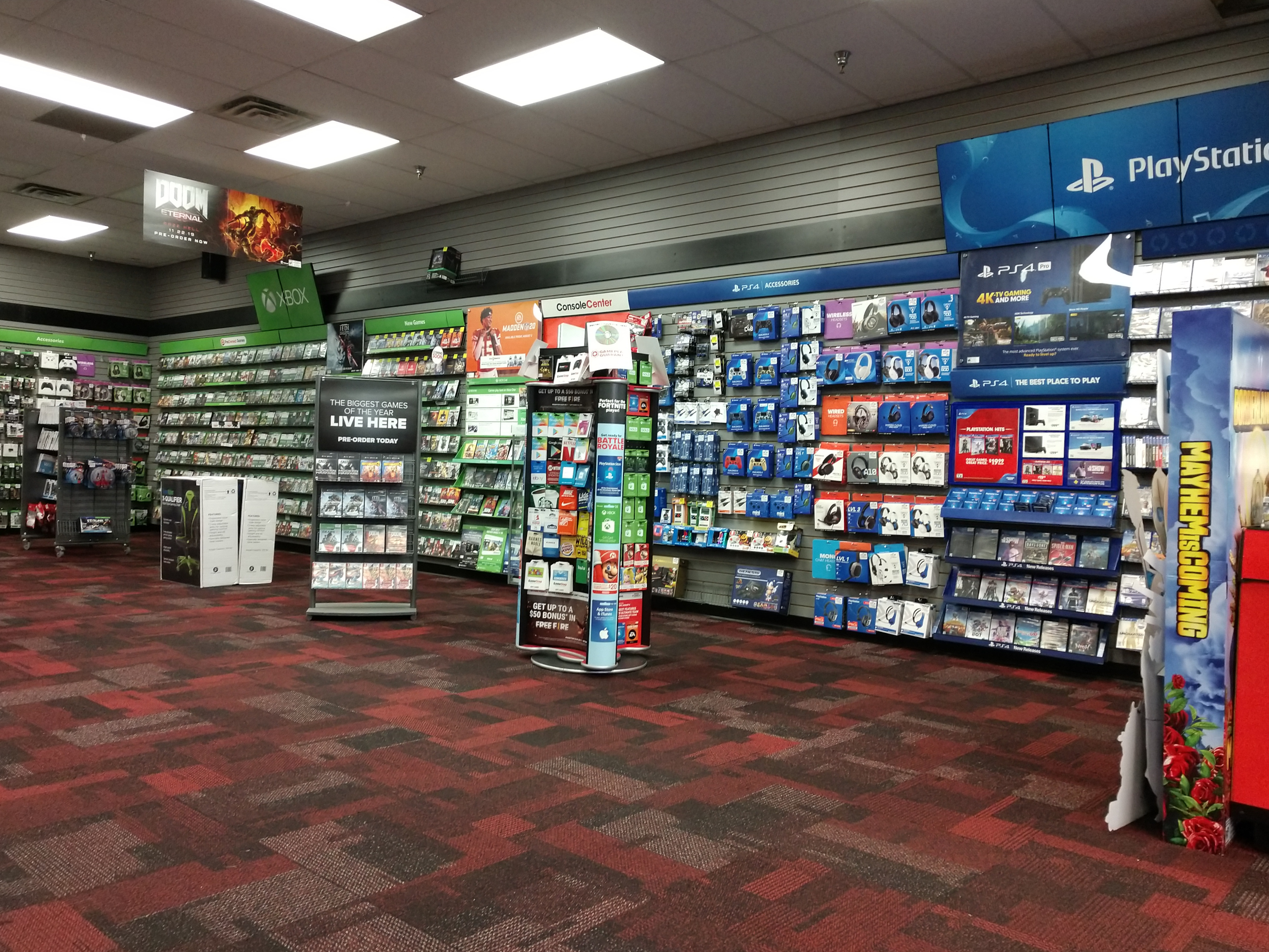 GameStation store interior with displays of video games, consoles, and accessories
